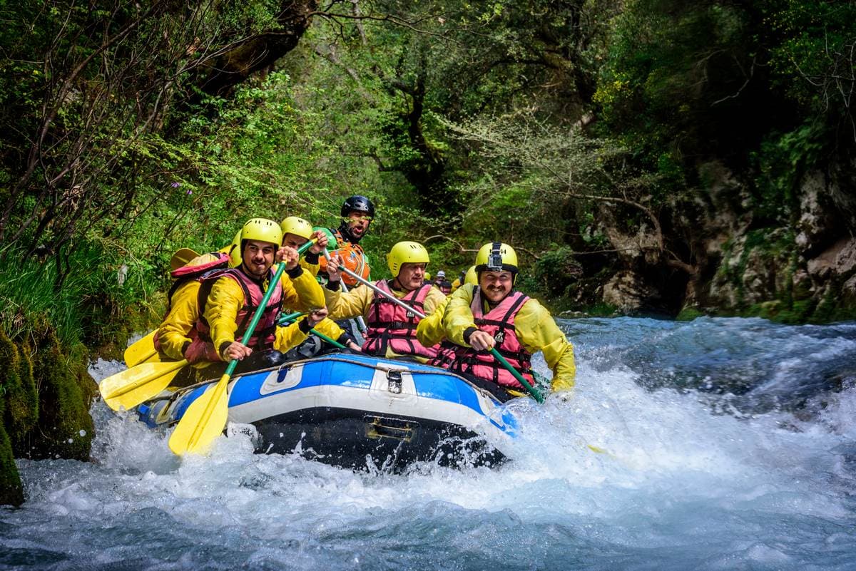 Guided rafting group navigating the whitewater rapids of the Lousios River in Arcadia, Peloponnese